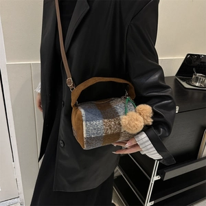 Chic plaid wool barrel bag with corduroy handles and fluffy pom-poms for women