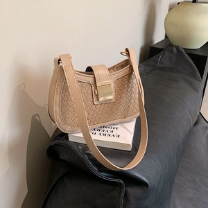 Minimalist beige woven leather shoulder bag with gold metal buckle and long strap