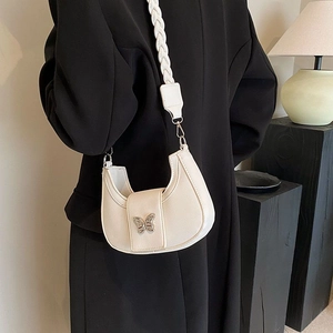 Chic white crescent shoulder bag with silver butterfly buckle and braided strap