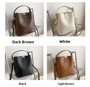 Detail view of four color options for the minimalist leather bucket bag with top handles