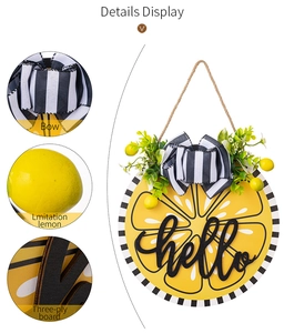 Detail display of wooden lemon door sign with bow, green leaves and 3D hello text