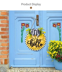 Detailed view of Hello summer lemon wreath with realistic greenery and striped bow on door