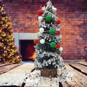 Mini Christmas tree with red and white pom poms and crystal beads on a wooden base