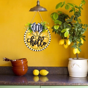 Close-up of wooden lemon welcome sign with 3D hello text and striped bow detail