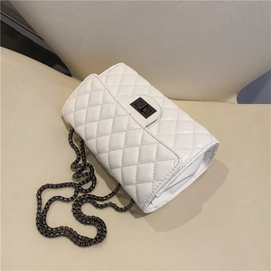 White quilted faux leather chain crossbody bag with black metal turn-lock closure