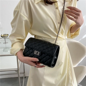 Classic black quilted chain bag with silver twist lock and minimalist design for women