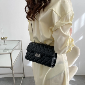 Classic black quilted crossbody bag with silver chain strap and metal swivel lock buckle
