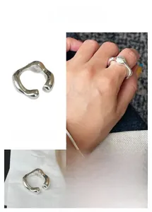 Close-up of S925 sterling silver stamp on an irregular twisted minimalist open ring