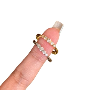 Minimalist stackable gold and silver rings featuring five round-cut CZ stones on slim bands