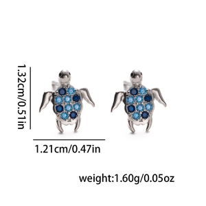 Silver turtle stud earrings with blue gemstone inlay and specific product dimensions