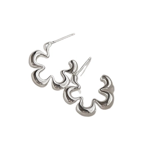 Minimalist geometric hollow flower earrings with polished silver finish on white background