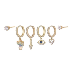 Detail of 6-piece gold earring set featuring evil eye, heart, and cactus charms