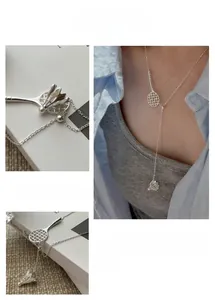 Detail of silver badminton racket pendant necklace with adjustable drawstring chain