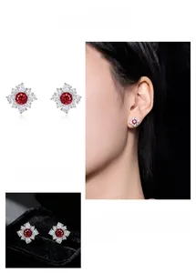 Detail view of French retro red zircon flower earrings with sparkling crystals