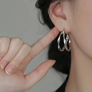 Polished silver twisted double-layer hoop earrings for women with minimalist design