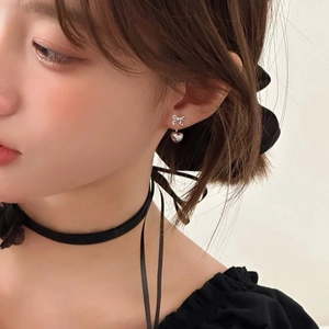 Elegant silver bow and heart pendant earrings with delicate heart engraving for women
