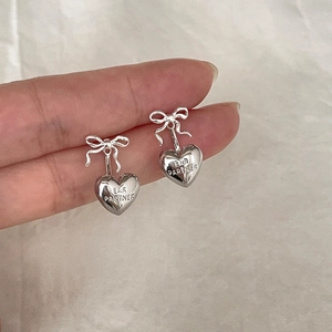Elegant silver bow and heart pendant earrings with engraved lettering for women