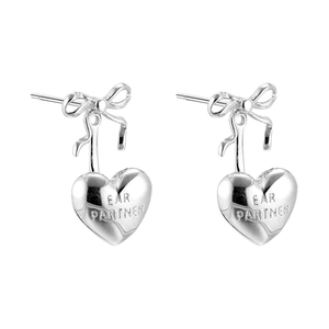 Elegant silver bowknot stud earrings with heart pendants and decorative engraving
