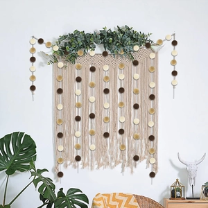 Decorative paper garland with brown, cream, and gold glitter circles for party backdrop