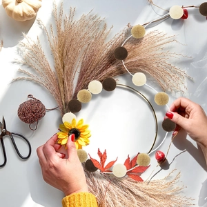 DIY autumn felt ball wreath kit with golden metal ring and maple leaf decor