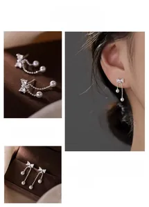 Macro detail of bowknot pearl tassel earrings with silver finish and sparkling zircon stones