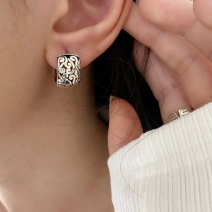 Hollow cloud pattern silver earrings shown on model for a trendy retro look