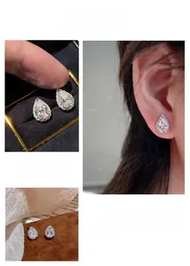 Detail view of teardrop zircon stud earrings in S925 silver with elegant gift packaging