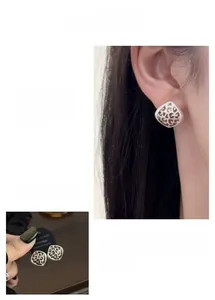 Macro detail of rhombic leopard print stud earrings with S925 silver needles