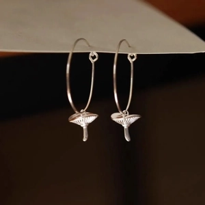 Polished silver mushroom hoop earrings for women with detailed realistic textures