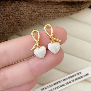 Elegant white marble heart earrings with gold ribbon knot design for women's fashion