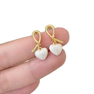 Elegant gold knot stud earrings with white marble texture heart drops for women