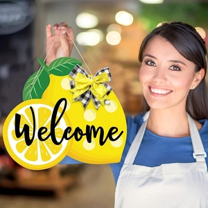 Lemon shaped wooden welcome sign with decorative bows for rustic front door decor