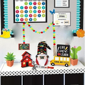 Colorful back-to-school gnome and wooden bus decor set on white shelf display