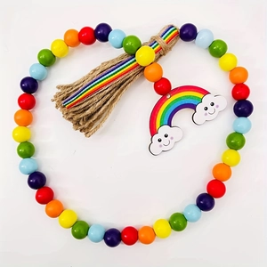 Macro shot of colorful wooden beads with rainbow pendant and natural jute tassel
