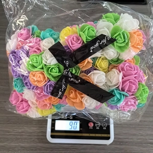 Detailed view of 90g colorful foam roses in a transparent bag for DIY crafts decoration