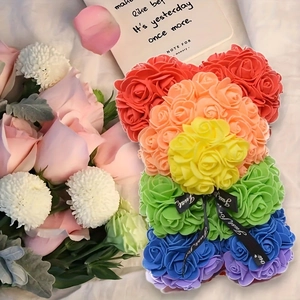 Close-up of rainbow foam rose bear with Just for you ribbon and pink floral background