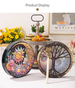 Detailed close-up of handmade Siberian shamanic drum with sun goddess and tree of life motifs