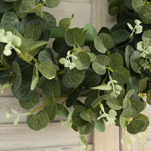 Macro detail of artificial eucalyptus leaves with realistic texture on wooden background