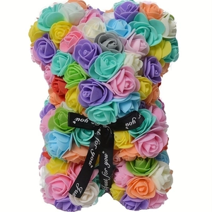 Detail of colorful PE foam roses and black ribbon on a decorative teddy bear figurine