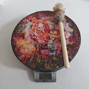 Detail shot showing the 210.5g weight of the handmade Shamanic drum on a digital scale