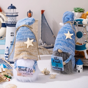 Detail of beach-themed gnomes featuring knitted caps, seashells, and nautical life signs