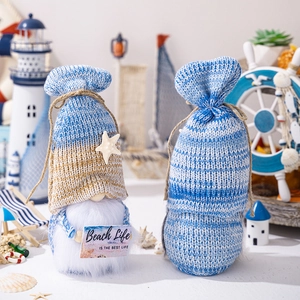 Detail showing knit beach gnomes with starfish, shells and Beach Life wooden sign