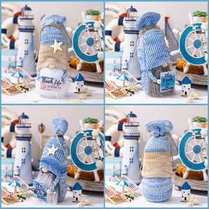 Detail showing plush beach gnomes with nautical hats and 'Beach Life' signage