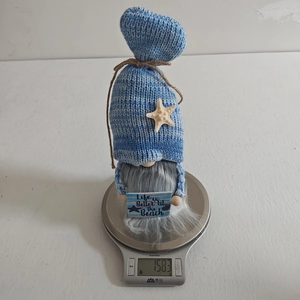 Nautical gnome plush weight display at 158.3g featuring beach sign and starfish hat