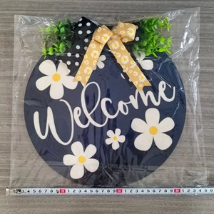 30cm wooden Welcome door sign with white daisies, green leaves and a burlap bow decoration