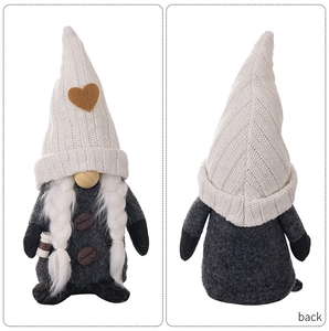Front and back detail of coffee gnome plush with knitted heart hat and latte cup