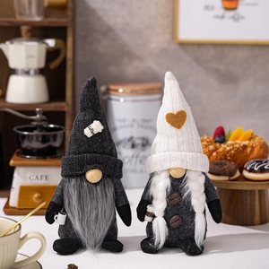 Close-up of coffee-themed gnomes with knitted hats and coffee cup details for cafe decor