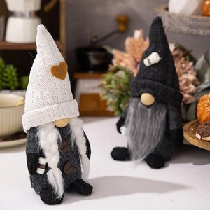 Close-up of coffee gnome duo with knitted hats and coffee bean button details
