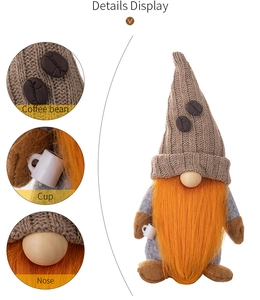 Detail display of coffee gnome with knitted hat, coffee bean decor and white cup