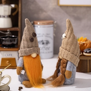 Detail of coffee gnome plush figurines with knitted hats and mini cups for cafe decor